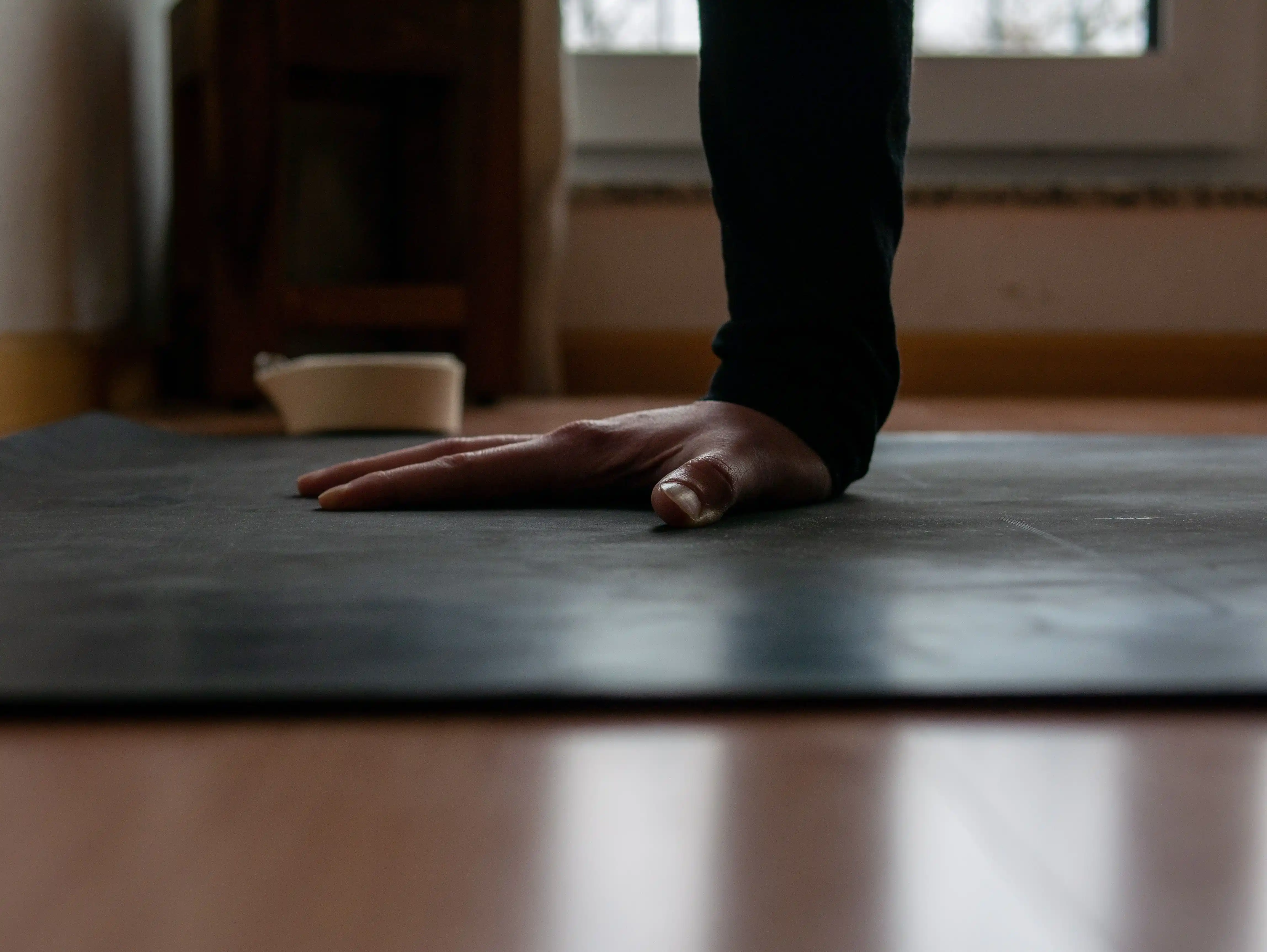 Close-up on Dafna's hand during yoga